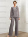 Grey chiffon pantsuit with crystal shoulder trim styled with a clutch