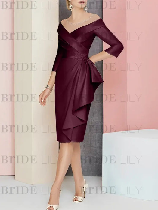 Off the shoulder sheath dress with a cascading drape in burgundy