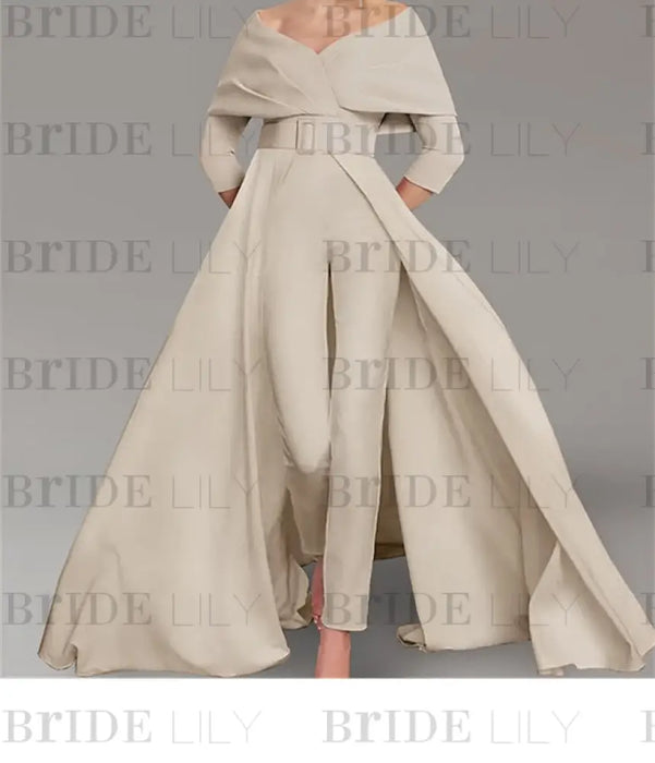 Off the shoulder jumpsuit with a belted waist and overskirt in champagne