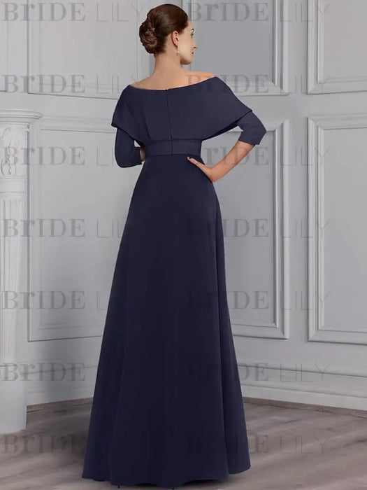 Back view of the navy jumpsuit with the overskirt closed