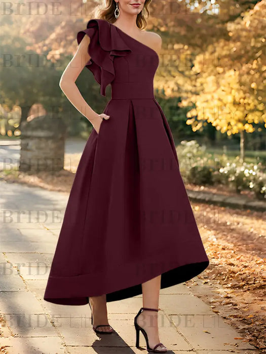 One shoulder mikado dress with a double ruffle in burgundy