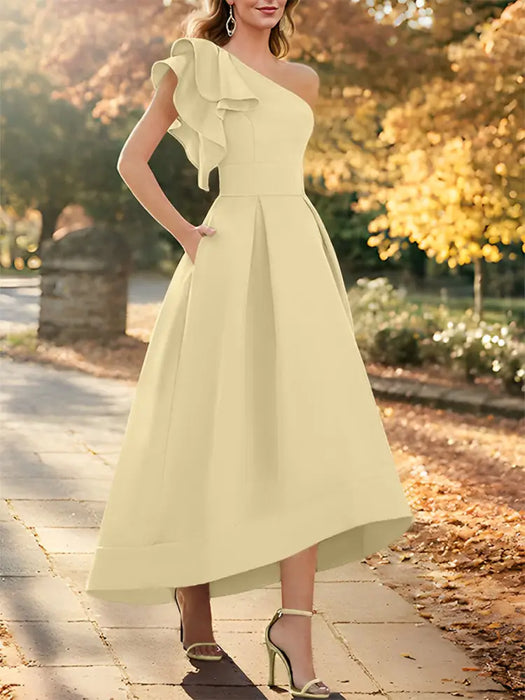 One shoulder mikado dress with a double ruffle in butter yellow