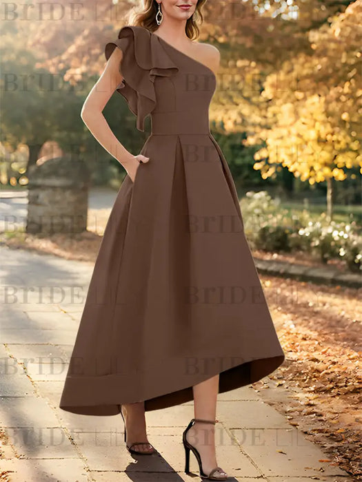 One shoulder mikado dress with a double ruffle in chocolate brown