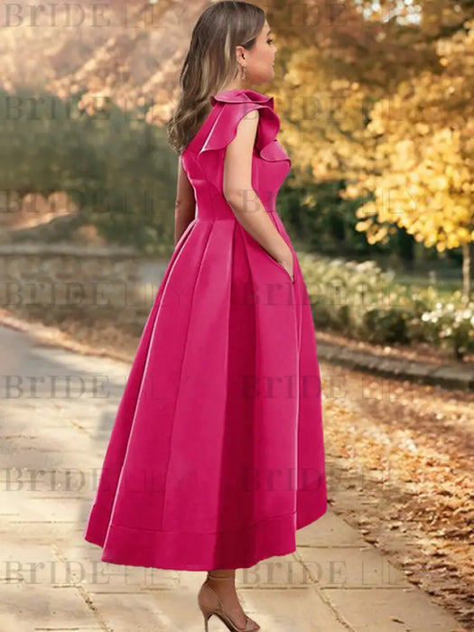 Back view of the fuchsia one shoulder mikado ruffle dress