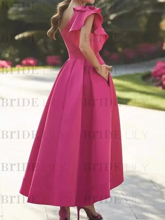 One shoulder mikado dress with a double ruffle in fuchsia