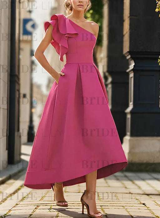 One shoulder mikado dress with a double ruffle in hot pink