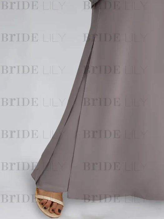 Detail of wide palazzo trouser hem in mauve grey chiffon