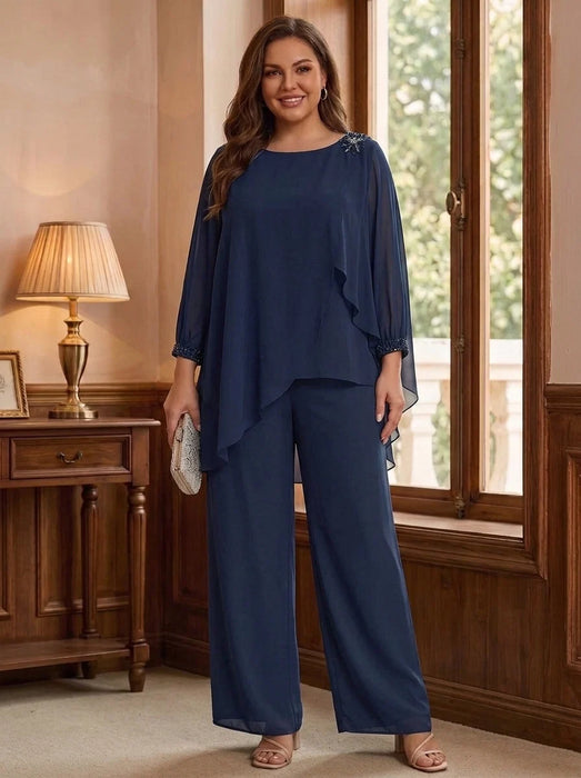 Navy chiffon pantsuit with beaded shoulder and cuffs on model