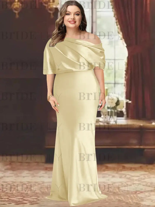 Plus size draped satin column gown with a blouson top in pale gold