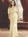 Plus size draped satin column gown with a blouson top in pale gold