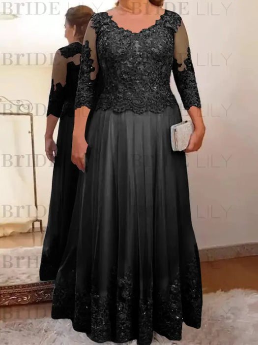 Black plus size mother of the bride lace and tulle gown with sleeves