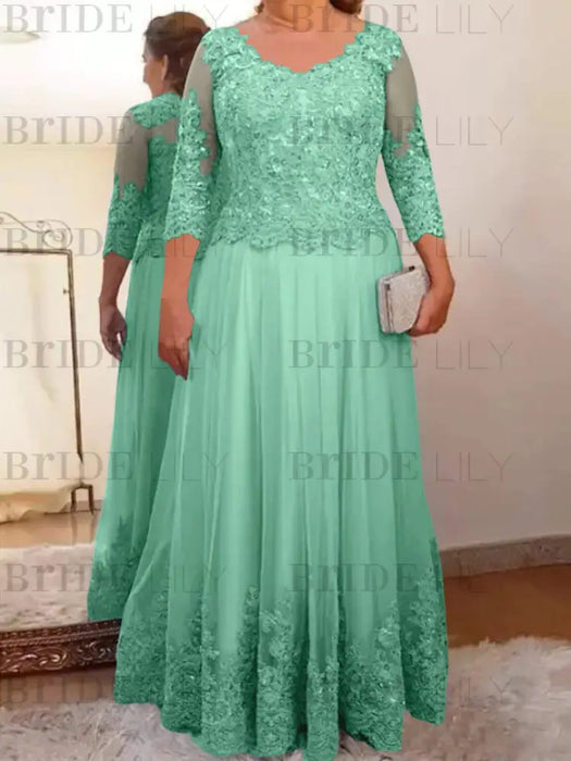 Spa plus size mother of the bride lace and tulle gown with sleeves