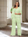 Plus size light green chiffon pantsuit with a rosette panel