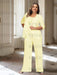 Plus size pale yellow chiffon pantsuit with a rosette panel
