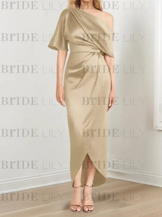 Satin dress with draped shoulder and waist knot in champagne gold