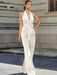 Satin halter jumpsuit with a bow belt in ivory