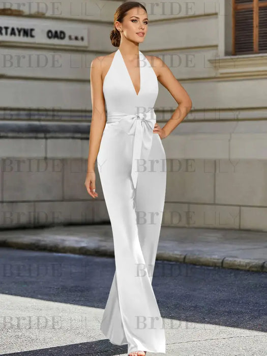 Satin halter jumpsuit with a bow belt in white