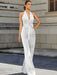 Satin halter jumpsuit with a bow belt in white
