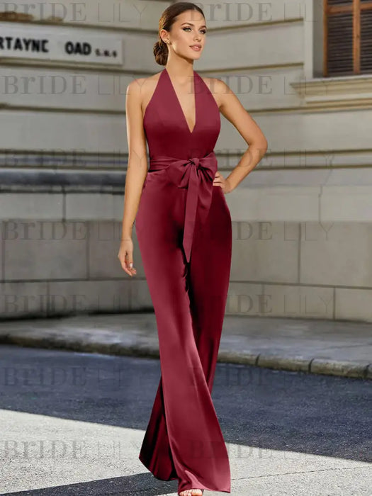 Satin halter jumpsuit with a bow belt in wine red