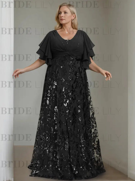 Plus size black gown with a chiffon bodice and sequin damask skirt