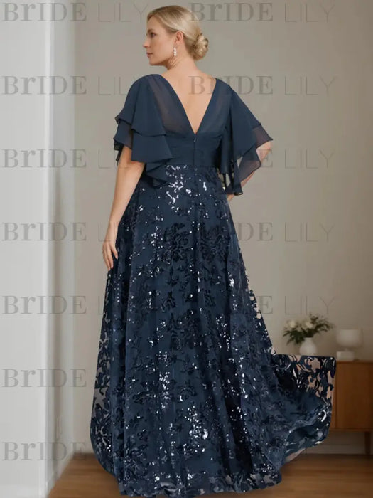 Back view of the navy sequin damask gown with a V back