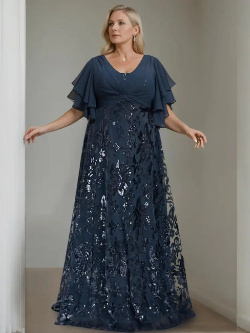 Plus size navy gown with a chiffon bodice and sequin damask skirt