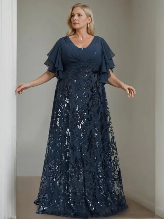 Plus size navy gown with a chiffon bodice and sequin damask skirt