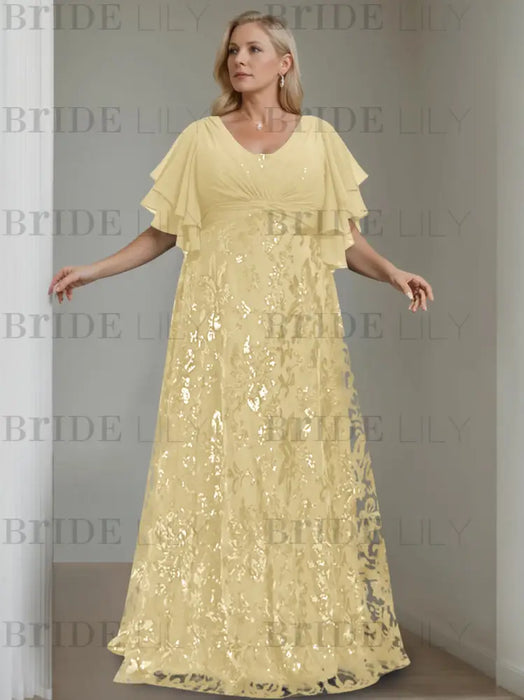 Plus size pale yellow gown with a chiffon bodice and damask skirt