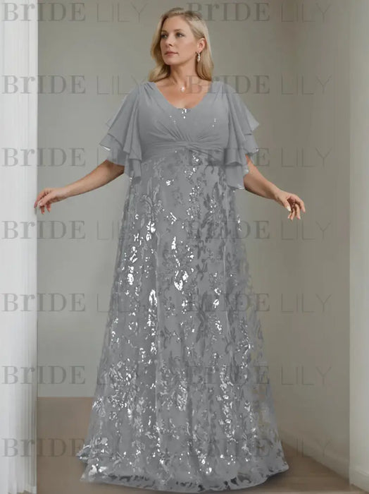 Plus size silver grey gown with a chiffon bodice and damask skirt