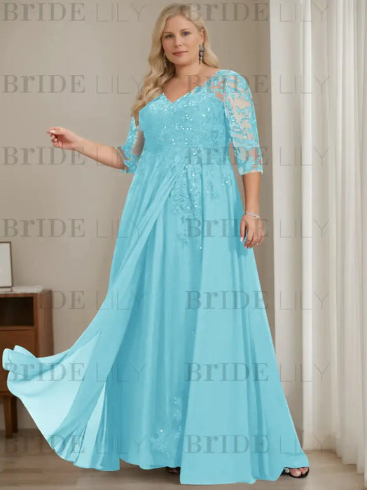Plus size aqua sequin lace gown with a draped chiffon sash