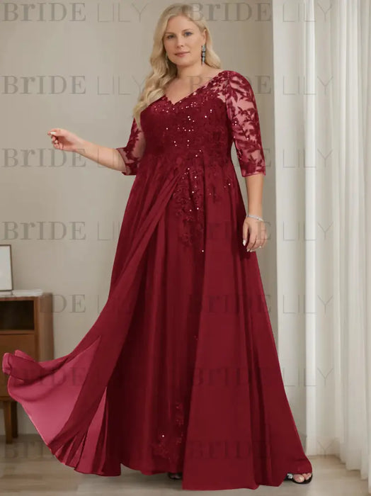 Plus size burgundy sequin lace gown with a draped chiffon sash