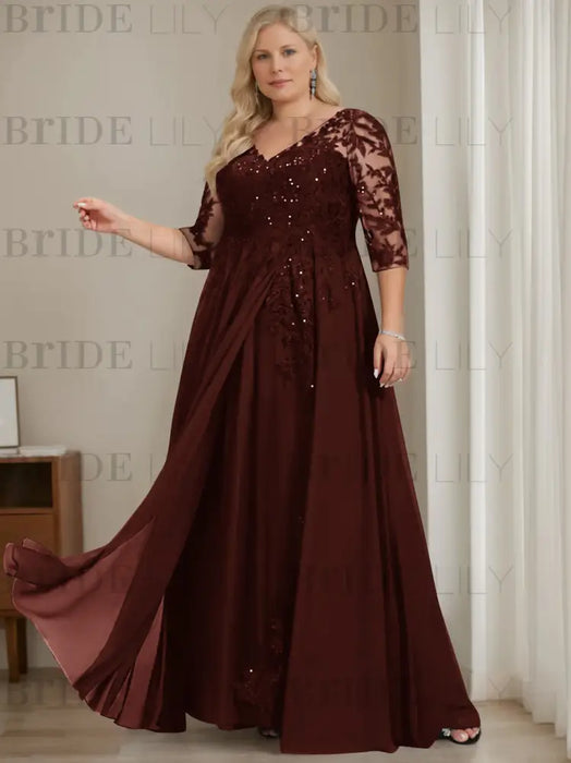 Plus size maroon sequin lace gown with a draped chiffon sash
