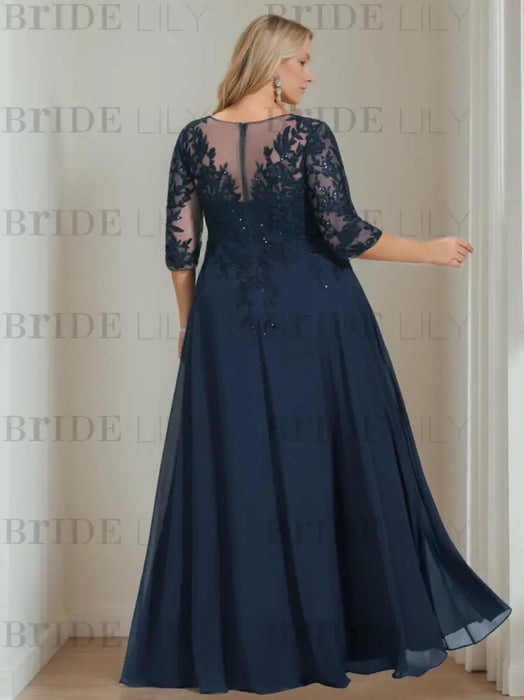 Back view of the navy sequin lace gown with an illusion back