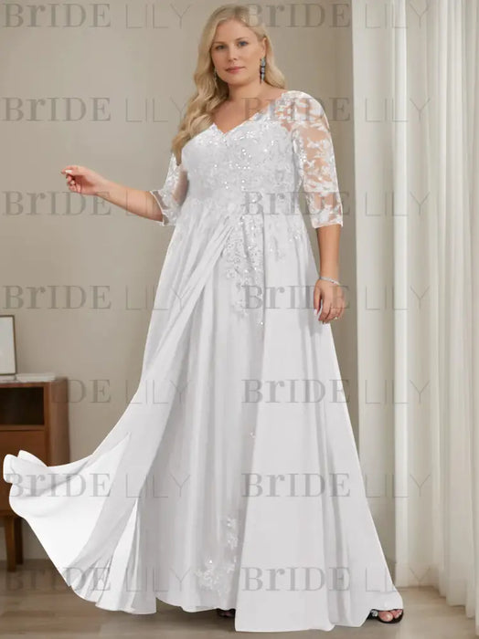 Plus size white sequin lace gown with a draped chiffon sash