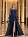 Navy sequin leaf chiffon gown with a front slit worn in a hotel lobby