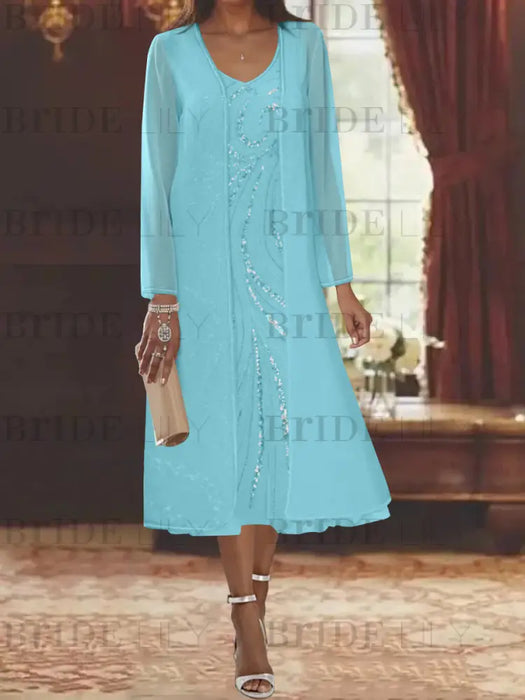 Aqua chiffon tea length dress with a sequin swirl and jacket
