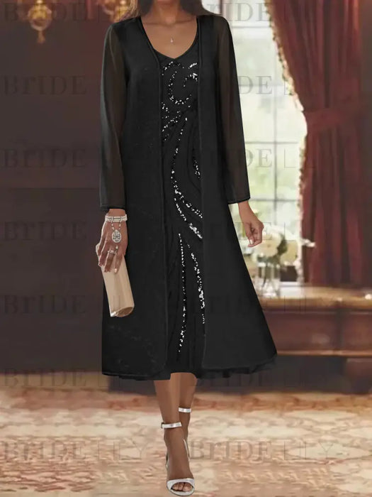 Black chiffon tea length dress with a sequin swirl and jacket