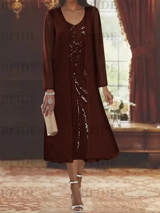 Brown chiffon tea length dress with a sequin swirl and jacket