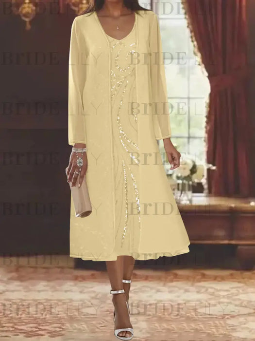 Butter yellow chiffon tea length dress with a sequin swirl