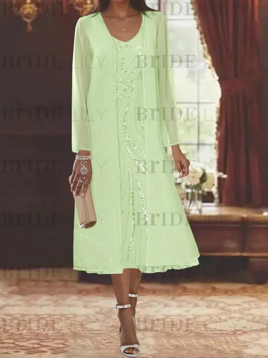 Light green chiffon tea length dress with a sequin swirl