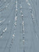 Close-up of the sequin swirl embroidery on dusty blue chiffon