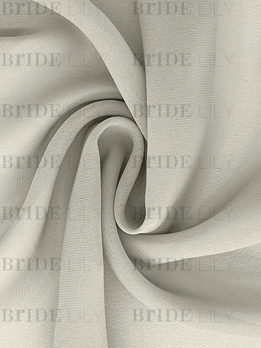 Close-up of the soft ivory chiffon fabric used for the overlay