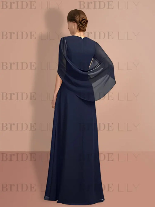Back of the navy chiffon gown with cape sleeves