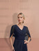 Close view of the navy chiffon V neckline and pleated bodice