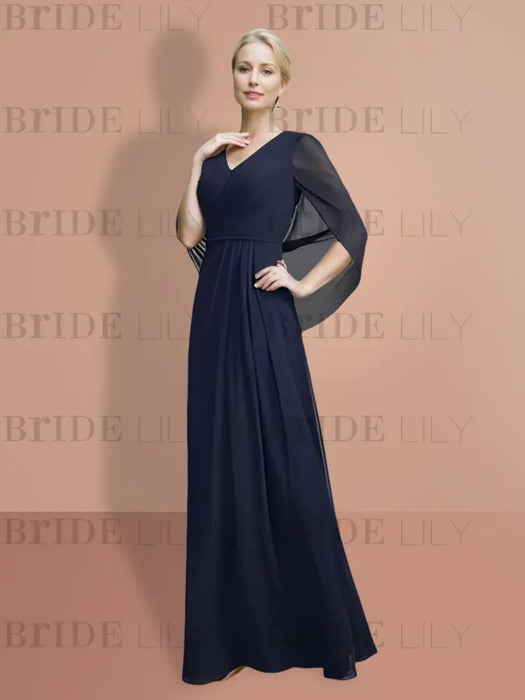 Full length view of the navy chiffon cape sleeve gown