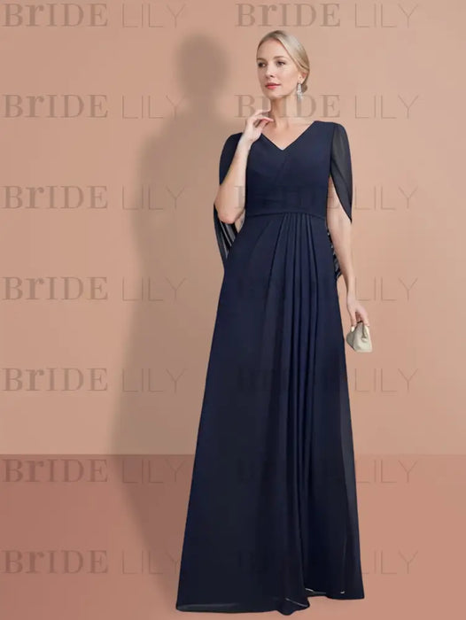 Side view of the navy chiffon gown and its draped panel