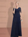 Side view of the navy chiffon gown and its draped panel
