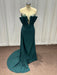Teal evening gown on a mannequin against a white curtain background
