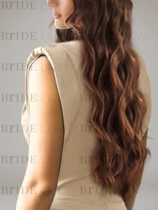 Close-up of the structured shoulder on the champagne satin gown