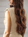 Close-up of the structured shoulder on the champagne satin gown